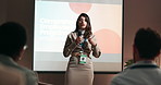 Development, presentation and speech with business woman in conference room for training. Education, microphone and public speaking with corporate coach on stage in auditorium for seminar event
