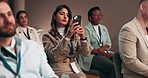 Business woman, seminar and phone for picture, workshop or corporate presentation. Mobile, photography and audience at conference convention for learning, training or share live event on social media