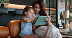 Mom, daughter or learning with tablet on sofa for digital interaction, engagement or app at house. Mother, child or kid with technology or UX for bonding activity, online education or home schooling
