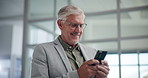 Happy, mature and businessman typing with phone for corporate improvement, humor or chat at office. Man, employee or executive with smile on mobile smartphone for business network or social media app