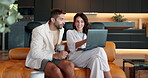 Laptop, pointing and smile with couple on sofa for joint bank account, savings fund and planning. Morning, loan application and credit sign up with man and woman in living room at home for research
