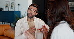 Frustrated couple, fight and argument with divorce on sofa for breakup, confession or conflict at home. Upset, man and woman with disagreemtn in dispute for toxic relationship or cheating affair