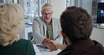 Businessman, discussion and meeting with handshake for hiring, recruitment or introduction at office. Man, executive or shaking hands with boardroom director for agreement, business deal or proposal