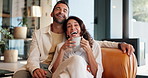 House, face and couple on sofa, coffee and relax with entertainment in living room. People, apartment and man with woman on couch, herbal tea or movie for break, funny or comedy with remote or love