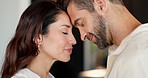 Forehead, house and couple with love, smile and bonding together in living room. People, apartment and man with woman, relationship and marriage with trust, care and affection with romance and calm