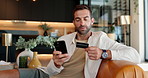 Man, online shopping and phone with credit card on sofa for payment, remote banking or app at home. Male person, shopper or customer with mobile smartphone or debit for virtual purchase or ecommerce