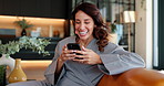 Home, funny and woman on sofa, smartphone and typing with internet, connection and network. Mature person, apartment and joke with cellphone, communication and social media with humor, smile or meme
