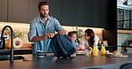 Family, child and morning with bag for school, breakfast or getting ready together in kitchen at home. Mom, dad and daughter with lunch, meal or food in preparation for kindergarten snack at house
