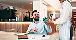 Happy man, customer and phone with pos machine at cafe for payment or wirelesss transaction at restaurant. Male person, purchase and mobile smartphone with tap for fintech or checkout at coffee shop