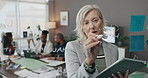 Presentation, tablet and business woman writing for finance, investment training or coaching team. Technology, mature manager and planning strategy on glass wall, schedule or brainstorming in office