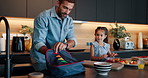Happy dad, child and morning with bag for school, breakfast or getting ready together in kitchen at home. Father, daughter and kid with lunch box for meal prep, food or kindergarten snack at house