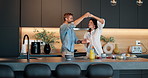 Happy couple, dancing and holding hands with morning in kitchen for breakfast, romance or bonding together at home. Man, woman or lovers with smile or fun for twirl or romantic relationship at house