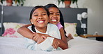 Happy, hug and face of kids on bed for bonding, love and sister relationship in morning. Family home, siblings and portrait of girls in bedroom for laughing, fun and playful together for childhood