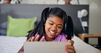Relax, happy and child on tablet on bed for online entertainment, watching cartoons and movies. Family home, laughing and young girl on digital tech for streaming videos or playing games in bedroom