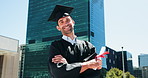 Pride, graduation and face of man in city with degree, certificate or diploma scroll. Education, excited and portrait of graduate with crossed arms for university achievement, goal or target in town.