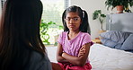 Support, love and mother with upset girl for advice, care and discipline of daughter in bedroom together. Trust, conversation and parent speaking to child for conflict, discussion or talking for fear