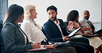 Business people, conference and audience in discussion, talking or brainstorming ideas for feedback. Group, convention and crowd together for training, handshake or networking at investment seminar