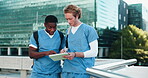 Medical student, men and studying with tablet outdoor for healthcare exam, online assessment and helping. Medicine, teamwork or people with digital app on rooftop for health knowledge and discussion