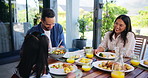 Family dinner, girl and parents with food for happy conversation, love or bonding together on patio. Father, mother and daughter for lunch, chat or relax with care, smile or laugh outside house