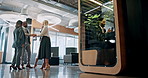 Collaboration, handshake and smile with business people in lobby of office for b2b deal or success. Conversation, meeting and teamwork with corporate employee group shaking in workplace for agreement