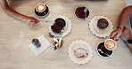 Group, hands and coffee with cake in cafe for eating together, lunch break and dessert treat. Top view, friends and people with cappuccino beverage for brunch meal, snack date and relax in restaurant