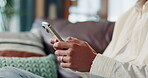 Home, sofa and hands with mobile for chat, online communication and comment on social media. Closeup, person and typing with smartphone for application, message and contact on dating website in house