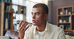 Man, phone and recording with speaker for communication, conversation or audio message on sofa at home. Male person, voice note or speech with mobile smartphone for sound or vocal reply at house