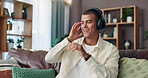 Happy man, dancing and sofa with headphones for music, listening or radio playlist at home. Male person, energy and fun with smile or hip hop in joy for audio, podcast or song album on couch at house