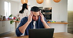Remote work, stress and man on laptop with headache, challenge and tired in home kitchen. Computer, freelancer and person with migraine, pain and frustrated with email for financial crisis or taxes