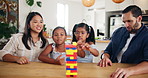 Home, parents and kids with blocks for game, cognitive development and bonding together as family. Kitchen, mom and dad with children for puzzle toys, playing and creativity with support in house