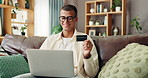 Home, sofa and man with laptop for credit card, banking app and payment for online shopping. House, glasses and happy person with digital for debit details, ecommerce and subscription for platform