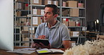 Tablet, computer and man in warehouse for logistics stock with cardboard boxes on shelf. Digital technology, packages and male delivery coordinator checking online order for ecommerce parcel.