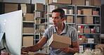 Small business, computer and man with order, warehouse and planning for delivery with tech and logistics. Boxes, entrepreneur and person with stock for supply chain, ecommerce and label for product