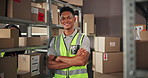 Face, logistics worker and confident man in warehouse for shipping, supply chain or ecommerce. Portrait, distribution and happy person with safety vest at shelf with arms crossed in fashion business