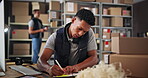 Small business, phone call and man with order, shipping and planning for delivery with notes or logistics. Warehouse, entrepreneur and person with boxes for supply chain, communication or online shop