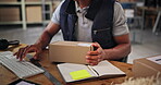 Small business, computer and hands with order, typing and preparing of product with label or logistics. Warehouse, entrepreneur and person with boxes for supply chain, ecommerce or planning for store