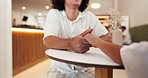 Coffee shop, holding hands and couple in cafe for conversation, talking and relax together. Dating, love and man and person with affection for bonding, relationship and commitment in restaurant