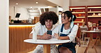 Date, couple and laughing with phone in restaurant for funny post, social media meme or comedy blog. Gen z people, happy or smartphone in bistro for streaming service, bonding together or gossip news