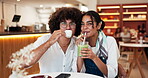 Couple, happy and face with drinks in cafe for bonding together, laughing and weekend break. Love, gen z people and support in restaurant with green smoothie, tea and holiday fun on travel adventure