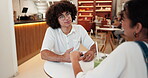 Couple, date and talking with holding hands in cafe for commitment, bonding together or connection. Love, happy people and drinks with conversation in restaurant for relationship, support or security