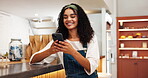 Woman, typing message and online in cafe, business owner and chat to supplier for update. Happy person, communication and professional app to schedule tasks, website and reading customer survey