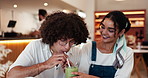 Coffee shop, drinking and couple share in cafe for bonding, relax together and enjoy date on weekend. Restaurant, happy people and woman and man sip with beverage, matcha and smoothie for romance