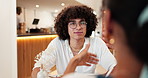 Couple, date and talking with listening in cafe for funny conversation, bonding and connection. Care, happy people and drinks with laughing in restaurant for relationship, flirting together and relax
