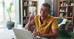 Happy man, wave and home office with laptop for video call, communication or online chat. Male person, financial advisor or accountant with smile on computer for remote work, help or virtual meeting