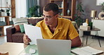 Man, finance and documents with laptop for income tax, investment or bank statement at home office. Male person, accountant or computer with documents for financial report or budget planning at house