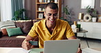 Happy man, laptop and online shopping with credit card for banking app, remote payment or transaction at home. Male person, shopper or user with computer or debit for ecommerce or fintech at house