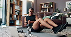Laptop, fitness and kettlebell with man in living room for streaming workout class, learning or health. Exercise, wellness and training with person and home gym for sports, virtual course and weights