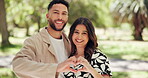 Face, heart hands and smile with couple in park for romance, love and care. Summer date, honeymoon and relationship with man and woman bonding in nature for support, trust emoji or happiness together