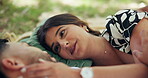 Relax, picnic and smile with couple in park for romance, love and care. Summer date, honeymoon and relationship with man and woman bonding in nature for support, trust and happiness together