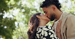 Care, love and kiss with couple in park for embrace, loyalty and romance together. Summer date, honeymoon and relationship with man and woman bonding in nature for support, trust and happiness